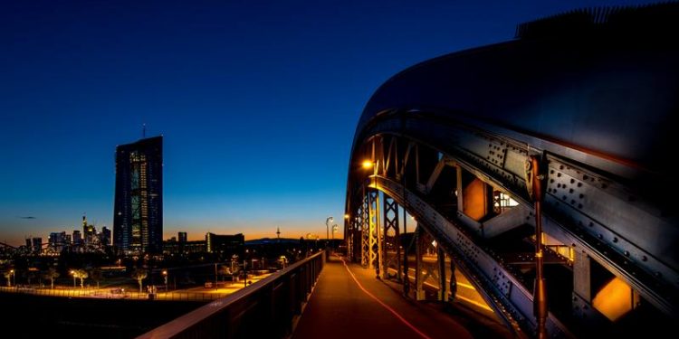 Shares higher in Europe as traders digest monetary response from governments and central bankers