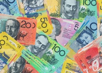 Aussie touches three-year trading highs